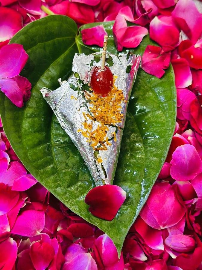 Paan on a fresh betel leaf with rose petals