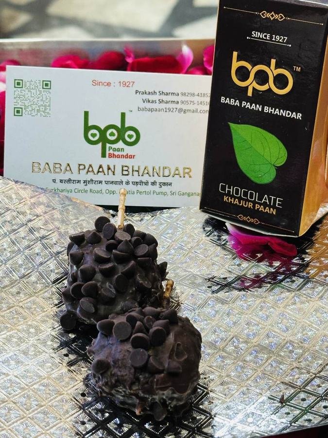 Chocolate Khajur Paan balls with packaging
